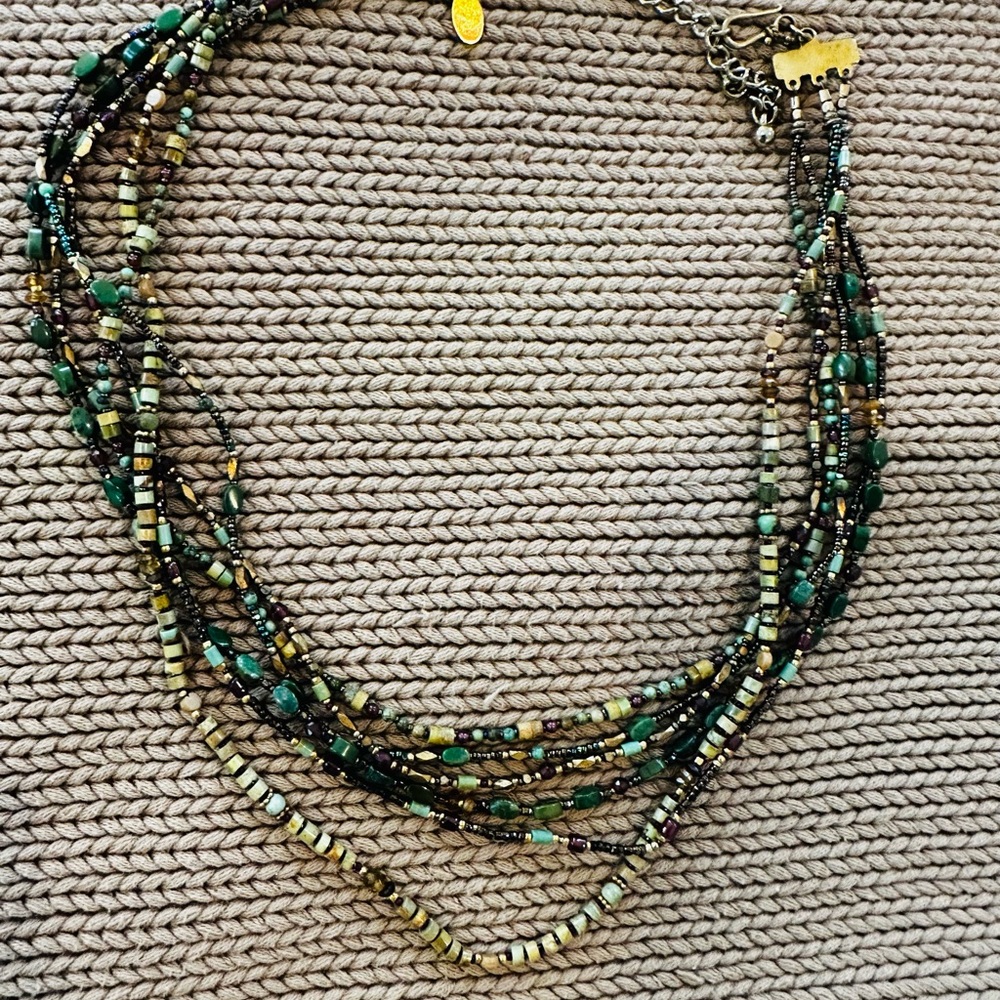 Chipita Multi-strand, green/gold/natural beaded necklace. From Aspen boutique.